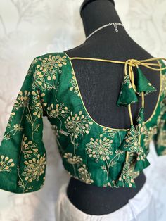 Bottle green Pure silk blouse blouse- with hand embroidered designs on neck and sleeve . sleeve -11 inches. well made blouses begins size 36 goes up to 44 . Lined padded blouses. Ships from Texas 💐 Green Art Silk Blouse With Intricate Embroidery, Green Embroidered Tussar Silk Blouse Piece, Dark Green Embroidery Blouse, Padded Blouses, Green Raw Silk Unstitched Blouse Piece, Green Raw Silk Unstitched Blouse, Red Velvet Blouse, Readymade Blouses Online, Silk Blouses