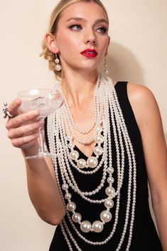 Description As quoted by Coco Chanel, "a woman needs ropes and ropes of pearls" and we delivered. This set is the epitome of a statement pearl necklace with earrings that are perfect together. Fashion cocktail jewelry set made with 10-line high quality pearl strands decorated with small and large pearls. Perfect for any special costume events. Size • Necklace respective lengths: 18' in., 20' in., 24' in., 28' in., 32' in., 34' in., 39' in., 42' in., 47' in., and 50 in. all connecting at each end Statement Pearl Necklace, Pearl Statement Necklace, Cocktail Jewelry, Pearl Necklace Earrings, Perfect Together, Pearl Strands, Necklace Earring Set, Coco Chanel, Multi Layering