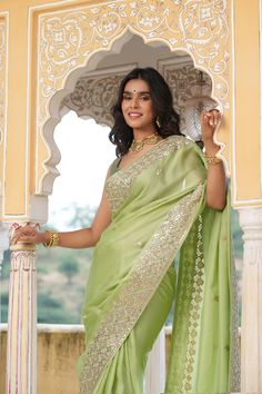 Gorgeous pista green embroidered tussar georgette sari is a perfect choice for weddings and festive occasions!. It comes with a saree blouse piece. Disclaimer: The actual product may vary slightly from the image. These are custom orders, hence expect slight variation in color, placement of the motif or buta. ESTIMATED DELIVERYBecause this is a custom order, it would take about 4 weeks from the date of purchase. RETURN POLICYThis product is a custom order and cannot be returned or exchanged. Green Tussar Silk Pre-draped Saree With Dupatta, Festive Green Tissue Silk Pre-draped Saree, Designer Chanderi Pre-draped Saree In Pista Green, Pista Green Chanderi Pre-draped Saree, Green Tissue Silk Blouse Piece For Navratri, Navratri Green Tissue Silk Blouse Piece, Pista Green Anarkali Style Pre-draped Chanderi Saree, Festive Green Chanderi Pre-draped Saree, Green Tissue Silk Saree With Zari Work