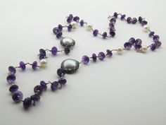 Amethyst is paired with a pearl in a necklace that is perfect for artists This is a stunning, natural necklace made from high-quality materials, amethyst, baroque pearls, Amethyst is associated with the Magical. Length 15 inç. ( 38 cm. ) Neck circumference 30 inç. (76 cm. ) Sending me requests and suggestions, please feel free to convo The product will be sent within a gift box and a gift bag For other inquiries, please visit the shop policies Thank you for visiting our shop http://www.etsy.com/ Silver Amethyst Necklace For Wedding, Wedding Amethyst Jewels Jewelry, Elegant Necklaces With Round Amethyst Beads, Elegant Purple Jewelry With Round Beads, Elegant Purple Necklace For Party, Elegant Long Pearl Necklace For Celebrations, Amethyst Necklaces For Wedding, Elegant Amethyst Necklace For Anniversary, Wedding Pearl Necklace With Gemstone