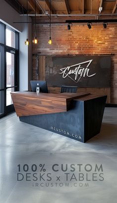 an office with brick walls and wooden desks in front of the sign that reads, custom desks & tables