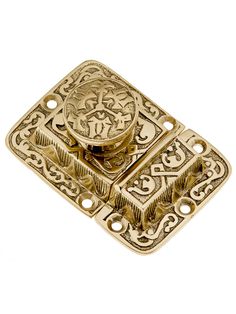 a brass plate with an ornate design on it