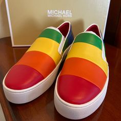 New, Never Used! Michael Kors Dylan Rainbow Sneakers Closure Style: Pull-On / Slip-On Features: Fashion Sneaker Material: Genuine Leather Style: Casual General Width Size: 6 - Women 1/2 “ Platform Color: Rainbow Never Used! Still In Original Box. Sporty Multicolor Slip-on Sneakers With Round Toe, Multicolor Leather Sneakers With Vulcanized Sole, Yellow Slip-on Low-top Sneakers, Colorful Vibrant Sneakers With Round Toe, Colorful Vibrant Round Toe Sneakers, Multicolor Sporty Slip-on Sneakers With Round Toe, Multicolor Synthetic Sneakers With Red Sole, Multicolor Flat Synthetic Sneakers, Yellow Low-top Slip-on Sneakers With Rubber Sole