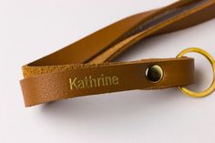 The perfect blend of style and functionality with our customizable leather lanyard. Designed to effortlessly hold keys and ID badges, wear it comfortably around your neck for hands-free convenience. Its double loop design over a golden split ring guarantees durability, while the matching rivet enhances stability. Ideal for nurses, teachers, coworkers, and bridal parties, this leather necklace lanyard can be personalized, making it a modern and thoughtful gift. Leather Lanyard, Gold Fronts, Loop Design, Leather Scraps, Bridal Parties, Gold Monogram, Modern Gift, Split Ring, Id Badge