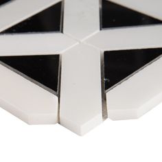 a white and black geometric tile design