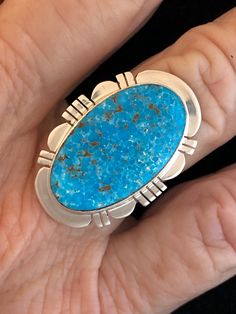 "This Turquoise gemstone is intriguing with its matrix. The Turquoise is Kingman Turquoise and has a deep blue Turquoise. Kingman Turquoise is found just off the highway about 20 miles Northwest of Kingman, Arizona. This is the highway to Las Vegas, Nevada. The ring is stamped, Sterling Silver and Paul Sanchez the artist Hallmark. Paul is a well-known silversmith and lives in the Albuquerque, New Mexico area. The ring weighs 10.22 grams and the ring measures 1 1/8\" X 7/8\" in size. This stunnin Collectible Blue Turquoise Inlay Ring, Southwestern Turquoise Chrysocolla Ring, Southwestern Chrysocolla Turquoise Ring, Collectible Untreated Blue Turquoise Ring, Southwestern Style Untreated Blue Turquoise Ring, Southwestern Blue Chrysocolla Rings, Southwestern Blue Turquoise Ring With Natural Stones, Southwestern Style Blue Turquoise Ring With Natural Stones, Southwestern Blue Jewelry With Large Stone