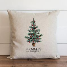 a pillow with a christmas tree on it