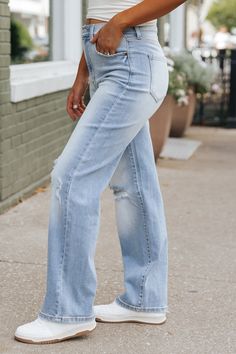 Elevate your denim game with our Light Wash Super High Rise Distressed Dad Jeans! Featuring subtle distressing and a super high rise fit, these jeans are perfect for a trendy yet comfortable look. Made with 93% cotton, 5% polyester, and 2% spandex, they offer both style and comfort in one. Simply pair them with a basic tank top and then layer it over a plaid shacket for an elevated fall look! Add some sneakers or cute ankle booties along with a few accessories to complete the look. High Rise Light Wash Distressed Jeans, High Rise Light Wash Jeans For Fall, Everyday Ripped Washed Blue Bottoms, High Rise Distressed Medium Wash Jeans, Everyday Distressed Mid-rise Bottoms, Distressed High Rise Jeans In Medium Wash, High Rise Medium Wash Distressed Jeans, Distressed Mid-rise Bottoms For Everyday, High Rise Distressed Bottoms For Everyday