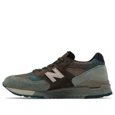 Add a touch of throwback style to your everyday look with the New Balance 998 Military Pack. This retro-inspired sneaker features layered suede and canvas overlays, atop a lightweight ABZORB midsole for cushioned comfort. The tongue patch and signature ‘N’ logo bring classic New Balance DNA to this must-have sneaker. (SNKR/Cozy/Low Top/Non-Slip/Made In Usa/Wear-resistant) New Balance Brown High-top Sneakers, Brown High-top New Balance Sneakers, Casual Brown New Balance Running Shoes, New Balance Urban Outdoor Sneakers, New Balance Urban Sneakers For Outdoor, New Balance High-top Sneakers With Vibram Sole, Urban New Balance Sneakers For Outdoor, New Balance Casual High-top Sneakers With Abzorb Midsole, New Balance Casual Outdoor Sneakers