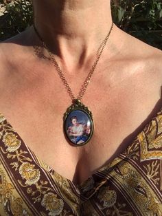 This is the first pendant in my new collection of French Rococo and baroque art! The pendant is approx. 2,2 x1,6 inch (5,5 x 4 cm) and is set in a leadfree antique brass setting. The necklace is a leadfree antique brass metal chain (length approx. 42cm). Due to the shape of the glass cabochon the light is reflected, so the real pendant is much more beautiful than the picture. The pendant is delivered in a nice gift pouch. Please feel free to follow me on instagram and Pinterest! Antique Metal Jewelry For Gifts, Antique Metal Jewelry As Gift, Antique Metal Jewelry For Gift, Antique Metal Jewelry Gift, Vintage Jewelry For Mother's Day Collectible, Vintage Collectible Jewelry For Mother's Day, Vintage Jewelry For Mother's Day Gift, Vintage Jewelry Gift For Mother's Day, Vintage Mother's Day Jewelry Gift For Her