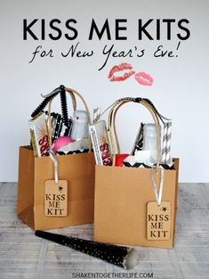 two brown bags with kisses me kits for new years eve on them and the words kiss me kit