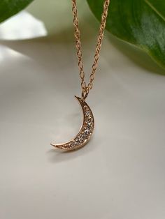 Dainty Diamond Moon Necklace  Pendant in 14k rose gold.This necklace is perfect by itself or or layered. You can wear it day or night. This necklace is versatile and perfect as a gift. Effortlessly trendy and beautiful!Metal.......14k Rose gold Pure gold /  Finish.... polish Necklace.....Handmade in USA Diamond weight......0.10CTG - VS1 quality *14k rose  gold chain included *Chain sizes Available.. 16”, 18” , 20 inches long Elegant Sterling Silver Crescent Charm Necklace, Elegant Everyday Crescent Charm Necklace, Elegant Moon Shape Clavicle Chain Necklace, Elegant Rose Gold Charm Necklaces For Everyday, Elegant Rose Gold Charm Necklace As Gift For Her, Elegant Rose Gold Charm Necklace For Her, Elegant Moon-shaped Necklace With Delicate Chain, Elegant Moon Phase Necklace, Elegant Yellow Gold Charm Necklace With Moon Phase