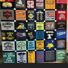 a quilt made out of t - shirts on display