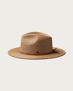 A hand-woven classic. This staple straw hat features a flat brim, medium stiffness and an authentic leather band. Made from the earth by expert artisans, it offers hand-made quality you can trust. Brown Woven Straw Fedora, Natural Woven Fedora For Rodeo, Handwoven Flat Brim Fedora In Toquilla Straw, Handwoven Fedora With Flat Brim In Toquilla Straw, Handwoven Toquilla Straw Fedora With Flat Brim, Western Brown Fedora With Woven Detail, Brown Woven Fedora With Short Brim, Western Brown Woven Fedora, Brown Woven Boater Hat With Short Brim