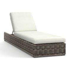 a wicker chaise lounger with white cushions on an isolated white background, 3d rendering