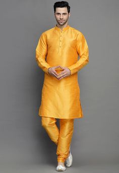 Art Silk Kurta in Yellow. This Readymade attire is Enhanced with Buttons. Crafted in Chinese Collar Neck and Full Sleeve. Available with an Art Silk Churidar in Yellow. Do note: Footwear shown in the image is for presentation purposes only. Half to one inch may vary in measurement. (Slight variation in actual color vs. image is possible). We sell all kinds of menswear. Mens Kurta | Mens Kurta Pajama | Mens Sherwani | Mens Sherwani Sets | Traditional Menswear | Partywear Menswear | Indian Mens Dr Yellow Art Silk Kurta With Dori Work, Orange Kurta For Wedding And Navratri, Orange Wedding Kurta With Traditional Drape, Yellow Art Silk Straight Kurta, Gold Self Design Kurta For Festivals, Gold Self-design Kurta For Festivals, Fitted Art Silk Sherwani For Puja, Orange Kurta For Navratri Puja, Orange Kurta For Puja And Navratri