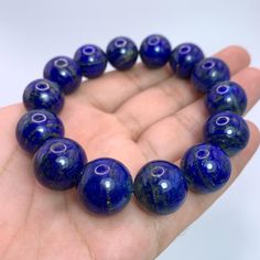 This Listing Is For Lapis Lazuli, The Photos Are Taken In Studio And Color Is Not Enhanced, If You Want Us To Take Photos In Natural Light Please Ask Before Purchase. DESCRIPTION: HAND MADE IN AFGHANISTAN BEST GIFT FOR FAMILY & FRIENDS SPECIFICATION: GEMSTONE TYPE:    Lapis Lazuli WEIGHT:                    98 Grams COLOR:                     Blue SIZE:                           16-17 mm Beads In Bracelet ORIGIN:                     Afghanistan QUANTITY:                One FINISH: Polished Beads Lapis Lazuli Round Bracelets, Polished Beads Lapis Lazuli Bracelets, Round Lapis Lazuli Bracelets With Polished Beads, Lapis Lazuli Beaded Bracelets With Polished Round Beads, Lapis Lazuli Bead Bracelet Gift, Gift Lapis Lazuli Round Bead Bracelets, Lapis Lazuli Beads With Natural Stones, Gift Lapis Lazuli Bracelets With Round Beads, Round Lapis Lazuli Beads With Natural Stones