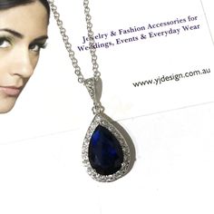 "A something blue navy sapphire cz drop bridal necklace with teardrop pendant made of cubic zirconia teardrop and brilliant cz hanging onto white gold silver rhodium bail and chain. You may also choose violet purple, emerald green or topaz brown pear drop to match your outfit or as a gift. Pendant is 1 1/4\" (3.1cm). Chain length can be added with a 2\" extender chain. View matching, similar design and other color options at https://etsy.me/2XN9lO3 View all something blue designs at https://etsy Cubic Zirconia Dangle Bridal Necklace For Gift, Cubic Zirconia Dangle Bridal Necklace, Cubic Zirconia Bridal Necklace With Teardrop Pendant, Teardrop Pendant Jewelry With Diamond Accents For Weddings, Fine Jewelry Teardrop Pendant For Party, Cubic Zirconia Dangle Drop Necklace For Formal Occasions, Wedding Jewelry With Diamond Accents Teardrop Pendant, Teardrop Pendant With Diamond Accents For Weddings, Teardrop Crystal Bridal Necklace Gift