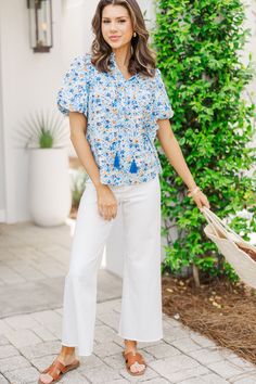 We think you are definitely going to remember this blouse very well! That ditsy floral print and those colors are all so pretty together! This bubble sleeve blouse is perfect for taking you from work to weekends! V-neckline with tassel ties Short bubble sleeves Ditsy floral print No stretch Savannah is wearing the small. Casual V-neck Blouse With Tassels, Blue Spring Top With Tassel Ties, Blue Spring Tops With Tassel Ties, Spring V-neck Blouse With Tassel Ties, Spring Cotton Blouse With Tassels, Blue V-neck Top With Tassels, Blue V-neck Tops With Tassels, Blue Cotton Blouse With Tassels, Casual Tassel Blouse For Spring