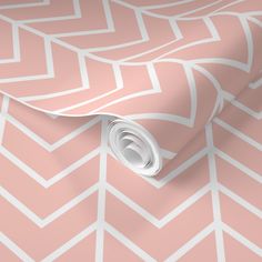 a pink wallpaper with white chevron lines