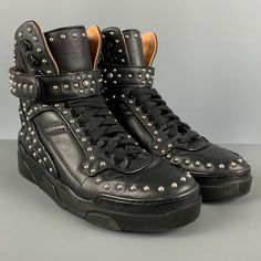 Givenchy High Top Sneakers Comes In A Black Leather Featuring A Silver Studded Details, Rubber Sole, And A Lace Up Style. Very Good Pre-Owned Condition. Light Wear. As-Is. Marked: 42 Measurements: Length: 11.5 Inches Width: 4.25 Inches Height: 8 Inches Sui Generis Reference: 124998 Category: Sneakers More Details Brand: Givenchy Size: 9 Gender: Male Color: Black Pattern: Studded Fabric: Leather Style: High Top Condition: As Is Age Group: Adult Sui Generis Designer Consignment Is An Award Winning Resale Store, Givenchy Shoes, Givenchy Man, Leather High Tops, Cate Blanchett, Leather Style, Studded Leather, Sneaker Brands, Black Pattern