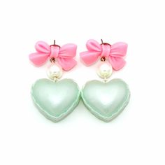 "These adorable earrings are perfect for Valentine's Day or anytime of the year! Pastel pearl finish heart shaped macaron charms filled with whipped cream hung below pink bow posts with glass pearls. Posts are hypoallergenic surgical steel. Choose pink, purple or mint green. Charms are about 1\" wide. Total earring length: about 2\". Matching necklaces and rings in my shop>> https://etsy.com/shop/fatallyfeminine **Made to order - please allow 2 weeks for your item to be made before shipmen Cute Heart Earrings For Valentine's Day Wedding, Pastel Drop Earrings For Gifts, Cute Heart Earrings For Wedding On Valentine's Day, Pastel Drop Earrings Jewelry As Gift, Cute Wedding Earrings For Valentine's Day, Sweet Pink Heart-shaped Earrings, Cute Pastel Jewelry For Gifts, Cute Pastel Jewelry For Gift, Valentine's Day Gift Kawaii Heart Earrings