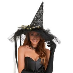 a woman wearing a black witch hat and gloves with lights on her head is posing for the camera