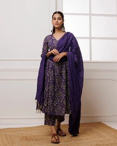 Add a touch of elegance to your wardrobe with our Violet Hand Block Printed Mul-Mul Suit Set. Made with high-quality mul-mul fabric and adorned with traditional Indian hand block printing, this striking violet suit set is perfect for any season. Complete the look with the matching dupatta for a stylish impact. No. of piece - 3 piece set. Color - Violet. Fabric - Mul-Mul. Washing Instructions - Dry Clean. Cotton Silk Kurta With Printed Motifs In Traditional Drape, Traditional Silk Palazzo Set With Bandhani Print, Traditional Slub Silk Palazzo Set With Printed Motifs, Traditional Silk Palazzo Set With Block Print, Elegant Bandhani Print Dupatta For Designer Wear, Elegant Designer Wear Dupatta With Bandhani Print, Designer Slub Silk Sets With Printed Motifs, Designer Block Print Kurta With Traditional Drape, Designer Silk Kurta With Block Print