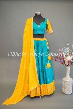 Teal Blue and Yellow Gadwal Silk Lehenga With Embroidered Hemline Of The Sleeves. Lehenga Blouse, Embroidered Dupatta, Silk Lehenga, Blouse Material, Kids Pants, Half Saree, Blue And Yellow, Wedding Wear, Blouse Dress