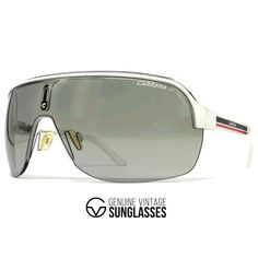 Details: -Color: White frame / Grey shield lens by Carrera -Size: Large / Frame width 141 mm / Frame height 53 mm / Temple length 115 mm -Made in Italy -Item-No. Carrera Topcar I Info/description: -Carrera's love for design and detail is evident from the spectacular collection of Carrera sunglasses that the brand has created for its fashion lovers worldwide. -The brand brings forth an opportunity to select from the most exceptional range of materials that range from aluminum to metal to plastic. Vintage Aviator Sunglasses With Tinted Lenses For Outdoor, Vintage Aviator Sunglasses With Uv Protection For Outdoor, Vintage Polarized Sunglasses For Streetwear, Retro Silver Polarized Sunglasses, Vintage Aviator Sunglasses For Summer Outdoor, Vintage Mirrored Sunglasses For Streetwear, Vintage Aviator Sunglasses With Anti-reflective Coating For Outdoor, Vintage Aviator Sunglasses For Outdoor With Anti-reflective Coating, Retro Sunglasses With Mirrored Lenses For Streetwear