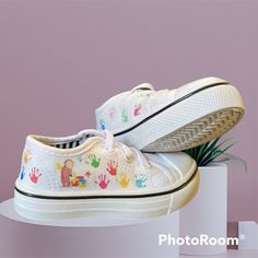 Custom Canvas Sneaker. Curious George With Pint Bucket Making A Mess As Usual!! And Multi Color Handprints All The Way Around The Shoe. White Non-slip Canvas Shoes For School, White Non-slip Canvas Shoes With Round Toe, White Canvas Shoes With Round Toe For School, White Canvas Shoes With Rubber Sole For School, White Canvas Shoes For School Summer, Low-top Canvas Shoes With Rubber Sole For Playtime, White Canvas Shoes With Rubber Sole, White Non-slip Fun Sneakers, Non-slip White Sneakers