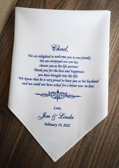 a wedding handkerchief with a poem written in blue ink on the front and back of it