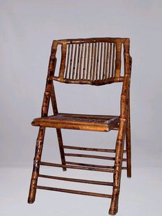 a wooden folding chair made out of branches and wood slats, on a white background