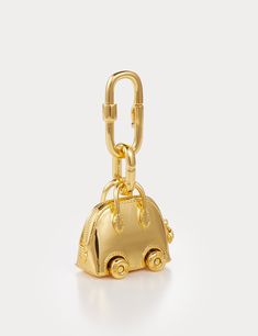 Inspired by Hermes Bolide On Wheels Bag Charm, Aelysee has meticulously crafted the Mini Bolide On Wheels Bag Charm, incorporating unique design elements. The charm features a separate clasp and chain, allowing you to customize it effortlessly with any of your handbags. Electroplated brass Charm size - 30 x 18.3 x 28.8mm Total weight 38g One year warranty Gold Bags With Logo Charm, Designer Gold Bags With Logo Charm, Luxury Gold Tarnish-resistant Charms, Gold Logo Charm Bag Charm, Christmas Tree Bag, Luxury Bag Charm With Keychain, Hermes Bolide, Tree Bag, Christmas Tree Collection