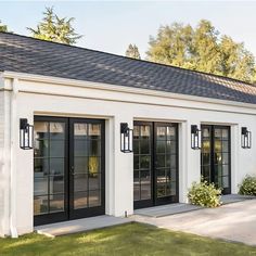 a white house with black doors and windows