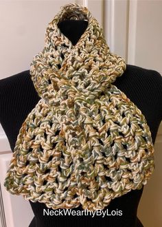 Looking for a short, warm, comfortable, easily-adorned scarf?  Well, here it is, just for you! MATERIALS Double-Thread (two yarns) 100% Acrylic  "I Love This Yarn" brand - Green Camo Stripes "I Love This Yarn" brand - Ivory Hand-crocheted by me in my smoke-free studio.  SIZE Approximately 39" long by 5-1/2" wide FEATURES 🧣 Double-thread construction.  🧣 Fashionably short, open weave, crochet, keyhole, pull-through scarf.  🧣 Fits cozily around your neck hanging straight or criss-crossed by inserting end of scarf into keyhole opening.  🧣 Medium-weight scarf can be worn comfortably both indoors (air conditioned spaces in summer  or with lowered thermostat in winter) and outside depending on the season. 🧣 Also a perfect scarf for folks in assisted-care.  CARE INSTRUCTIONS Hand wash or mac Casual Cream Scarves One Size Fits All, Casual Cream Scarf One Size, Casual Cream Scarf, One Size, Beige Casual Scarf, Casual Beige Scarf, Handmade Casual Scarves For Fall, Casual Green Handmade Scarf, Casual Crochet Scarves For Fall, Open Weave Crochet