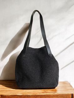 Any woman must have this bag for every fashionista. Whether you keeping it to yourself or gifting someone you care, it will be unforgettable. ✔️I made this beautiful bag from natural paper rope which is organic cotton and vegan leather in black. ✔️The interior of the straw summer bag is fully lined with cotton and has a magnetic button. Suitable for use as shoulder bag, beach bag, travel bag or party bag. ✔️The bag has cotton lining. A lining of the appropriate color is sewn into the crochet pap Black Bucket Bag With Large Capacity For Vacation, Black Large Capacity Bucket Bag For Vacation, Black Shoulder Bag With Braided Handles For Travel, Black Handheld Bag For Vacation, Black Handheld Bags For Vacation, Black Handheld Vacation Bags, Square Woven Hobo Bag For Vacation, Elegant Beach Bag With Leather Handles For Vacation, Trendy Beach Hobo Bag With Leather Handles