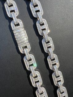 Men's 14mm wide moissanite baguette gucci link chains
One the iciest chains we ever made
 
REAL VVS D Color MOISSANITE
Comes with GRA Certificate
PASSES DIAMOND TESTER!!! ANY PEN OR LIGHT TRANSMISSION DIAMOND TESTER (Will show up as moissanite and not diamond on lab assays however)
Fully flooded out for an iced look
Iced with mix of baguette and round moissanite stones.
18" - 11.83ct round + 25.1ct baguette = TW 36.93ct
24" - 15.76ct round + 33.47ct baguette = TW 49.23ct
28" - 18. Gucci Link Chain, Diamond Tester, Heavy Chain, Link Chain Necklace, Round Moissanite, Matching Bracelets, Polish Jewelry, Chain Link Necklace, Selling Jewelry