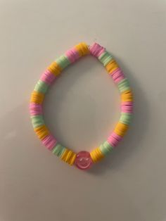 This bracelet is created to give off a summer vibe, with its outstanding bright colors and happy atmosphere it will for sure give you the right summer energy you need. Spring Festival Pink Beaded Bracelets, Pink Beaded Bracelets For Spring Festival, Handmade Trendy Yellow Friendship Bracelets, Fun Green Bracelets For Friendship, Playful Green Plastic Bracelets, Colorful Fun Summer Jewelry, Trendy Handmade Yellow Bracelets, Playful Multicolor Beaded Bracelets For Vacation, Handmade Trendy Yellow Bracelets