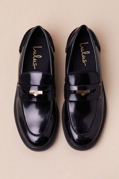 From class to the office, no one keeps things as chic as the Lulus Halliday Black Patent Penny Loafers! Sleek, faux patent leather shapes these timeless loafers that feature a rounded-toe upper, a notched collar, and a traditional cutout strap at the vamp with a coin-like medallion at the center. The simple slip-on design makes for effortless everyday styling. Available in whole sizes only. 1" rubber sole. Lightly cushioned insole. Rubber sole has nonskid markings. Man made materials. Imported. Chic Patent Leather Platform Loafers For Business, Chic Patent Leather Platform Loafers For Office, Chic Office Platform Loafers In Patent Leather, Modern Patent Leather Loafers For Office, Patent Leather Platform Loafers For Work, Sleek Patent Leather Loafers For Work, Sleek Patent Leather Office Loafers, Elegant Platform Loafers With Round Toe In Patent Leather, Elegant Patent Leather Platform Loafers With Round Toe