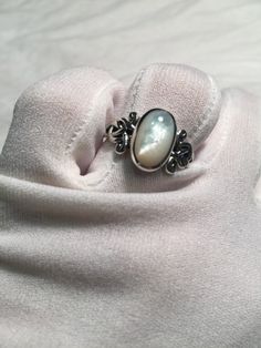 Lovely polished 925 sterling silver has the look of white gold set with a huge white Mother Of Pearl set in very detailed vintage filigree Size 7, 8, 9, 9.25 and 10 All rings are shipped free in the US in a nice gift box. Check out our over a THOUSAND great reviews Engraving is $4 per letter and is not always perfect depending on the piece. It can take a few days if the jeweler is busy. This is payable to Paypal Judithsltd@gmail.com Elegant White Engraved Rings, Classic White Engraved Rings, Elegant Sterling Silver Moonstone Ring For Anniversary, Classic Engraved White Rings, Elegant White Gold Moonstone Ring In Sterling Silver, Elegant Moonstone Ring In White Gold Sterling Silver, White Cabochon Moonstone Ring For Formal Occasions, Elegant White Filigree Ring With Intricate Design, Classic White Filigree Ring With Intricate Design