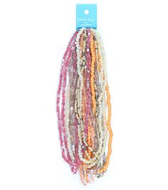 multicolored beaded bracelets with white and orange beads on each strand, hanging from