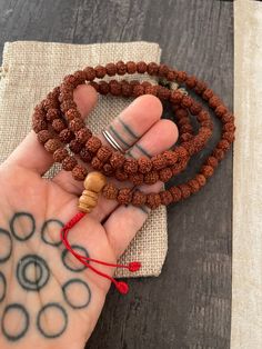 ------Price per Item------ Small Rudraksha 108 mala necklace that can be used as a bracelet also. Small rudraksha beads, creating this simple yet powerful mala necklace for you to add to your mala collection. The mala necklace is13.75 inch long without the tassels. A necklace to keep you in styke and grounded at the same time. ⚡️GET 20% OFF NOW⚡️ JOIN AKASHI'S VIP LIST and Shop ⚡️Join Akashi's VIP list for early bird discount access⚡️ Paste into your browser http://eepurl.com/hgCMM1 and follow t Hand Wrapped Mala With Round Beads For Meditation, Hand Wrapped Round Beads Mala For Meditation, Hand Wrapped Mala For Meditation, Handmade Spiritual Mala For Puja, Holistic Mala With 108 Beads For Festival, Spiritual Round Beads Mala For Puja, 8mm Beaded Mala For Festivals And Gifts, Hand-strung Spiritual Mala For Puja, Spiritual Mala With Round Beads For Puja