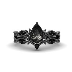 a black diamond ring with an intricate design on the front and center stone in the middle