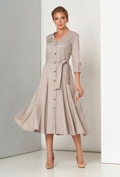 A classic elegant dress with a fitted silhouette, V-neck and 3/4 sleeves. Includes a belt. Material: costume linen Made in Europe Semi-formal Summer Dress With Button Cuffs, Fitted V-neck Linen Dress With Buttons, Formal V-neck Linen Dress, Formal Linen Dresses With Buttons, Formal Linen Button Dresses, Formal Linen Dress With Button Closure, Elegant Spring Linen Dress With Button Closure, Elegant Beige V-neck Linen Dress, Elegant Beige Linen V-neck Dress