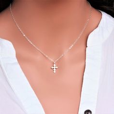 "Sterling Silver Cross Necklace - Religious Jewelry - Tiny Sterling silver CZ Cross Necklace - Layering Necklace Dainty Cross Necklace - Gift for Her ★★The necklace makes of .... -Sterling Silver 9.4x17.5mm Small CZ Cross Pendant, 3.2mm Closed Ring Sterling silver cable chain with spring claw . -Total length will be 16\" 17\" 18\" or 19\" depend on customer request. -Come up with beautiful ribbon gift box -One set of care instruction package that enhance your present ... All quantities are avail Sterling Silver Cross Pendant Charm Necklace, Silver Minimalist Cross Necklace With Clavicle Chain, Silver Charm Necklace For Her, Sterling Silver Clavicle Chain Cross Necklace, Spiritual Silver Charm Necklace With Clavicle Chain, Silver Cross Pendant Charm Necklaces, Silver Clavicle Chain Jewelry For Mother's Day, Silver Chain Charm Necklace As A Gift, Elegant Silver Cross Necklace With Round Pendant