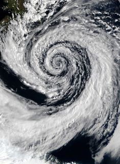 an image of a storm in the sky from space, with clouds and water swirling around it