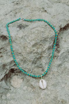 Elevate your beach ensemble with the Elsa Shell Necklace (named after our favourite Ibu). Made from recycled polyester beads, it's a sustainable and stylish choice. Rock it solo or layer it with our Balik Double Beaded Necklace for a vibrant summer vibe. Blue Strand Necklaces For Beach Season, Ocean-inspired Turquoise Necklaces For Vacation, Turquoise Ocean-inspired Necklaces For Vacation, Bohemian Hand-strung Beaded Necklaces For Beach, Turquoise Ocean-inspired Necklace For Vacation, Casual Vacation Beaded Necklaces With Beaded Chain, Hippie Hand-strung Beads For Beach, Casual Beaded Chain Necklace For Vacation, Casual Beaded Necklaces For Vacation