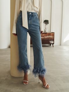 Straight cut jeans with a high waistline featuring fluffy feathers on the pant legs.- straight cut- high waistline- removable feather decor Fluffy Pants Outfits, Feathers Jeans, Jeans With Feathers, Feather Trim Jeans, Sewing Trendy Clothes, Pants With Feathers, Feather Clothes, Feather Pants, Feather Outfit