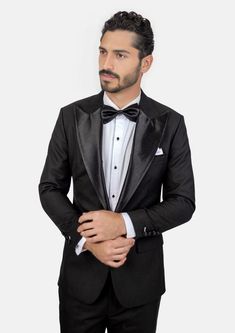 Crafted from a luxurious sharkskin weave wool, the Liberty Black Tuxedo is a sophisticated, statement-making formalwear option. Wide peak lapels in a single button configuration stand out from typical tuxedo styles. Dress to impress with this high-end, premium garment – a modern blend of elegance and refinement. Tuxedo Styles, Suit Guide, Styles Dress, Custom Made Suits, Blue Tuxedos, White Tuxedo, Vest And Tie, Black Bow Tie, Body Posture